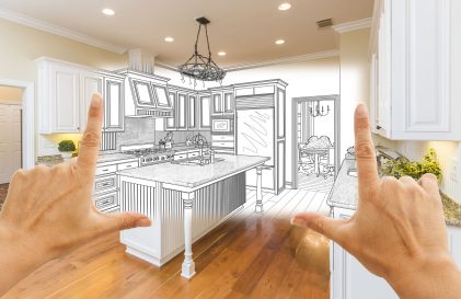 two hands point at a drawing of a kitchen.